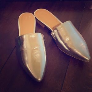 Brand New, never worn silver mules.